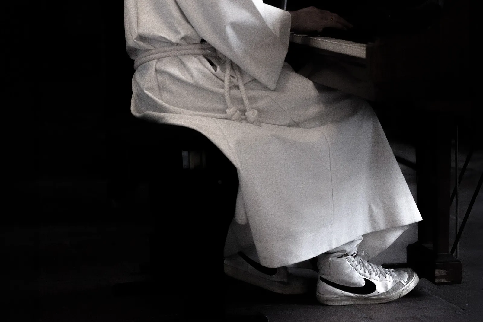 White robe at piano
